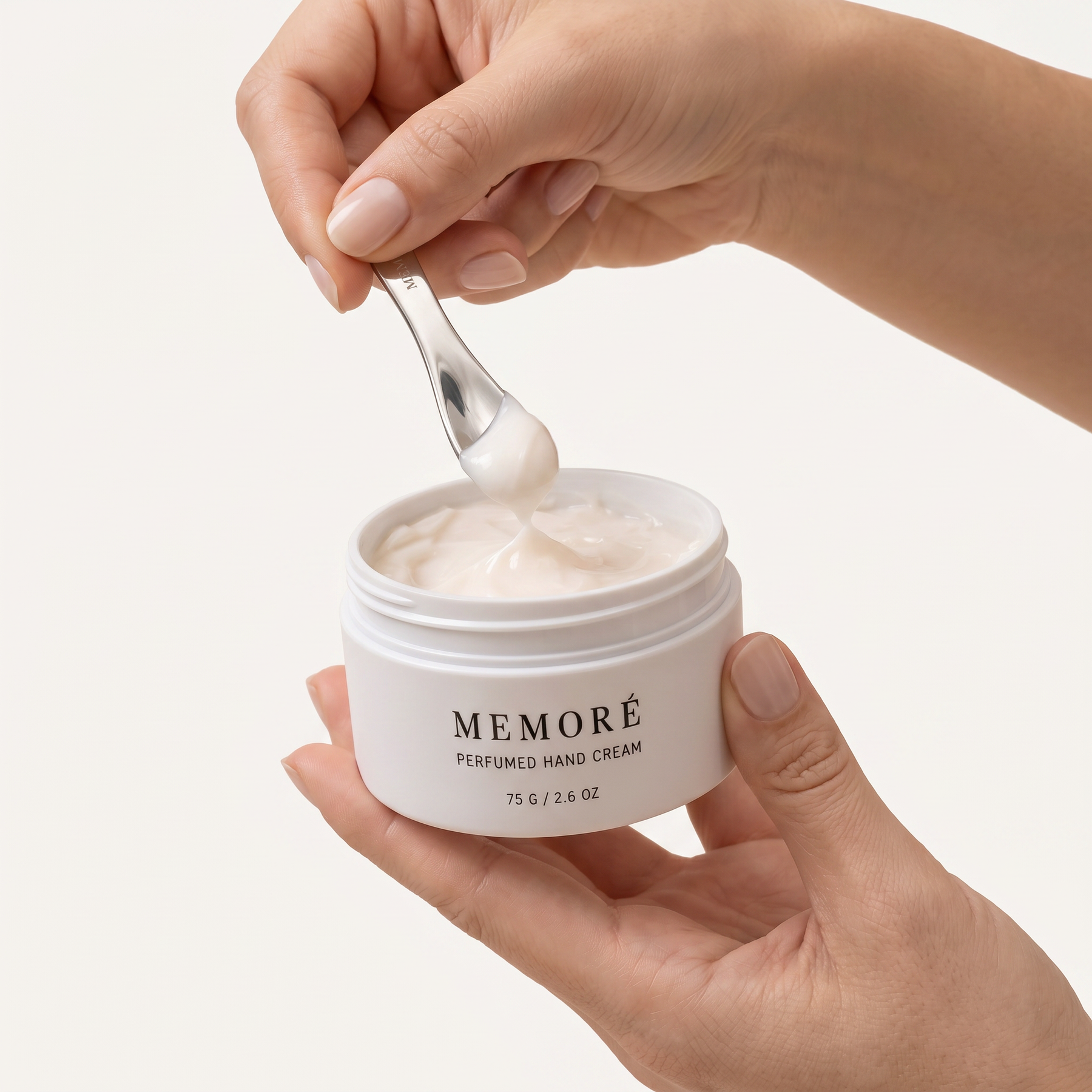 Applying Memoré hand cream with the included spatula